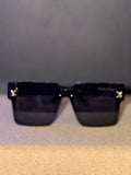 Ces lunettes de soleil Louis Vuitton